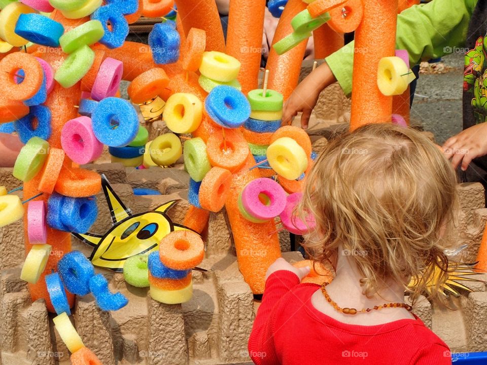 Child with colorful construction toy