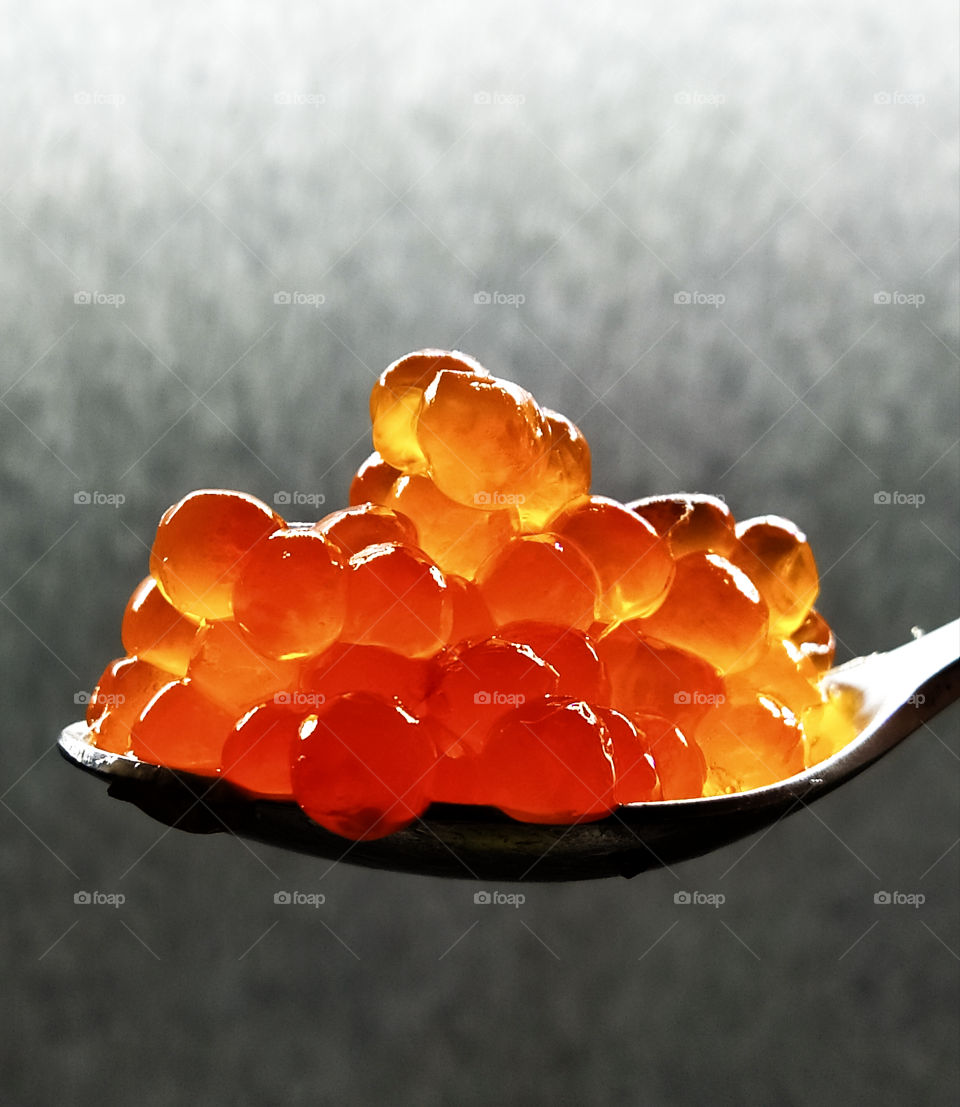 Spoon with red caviar