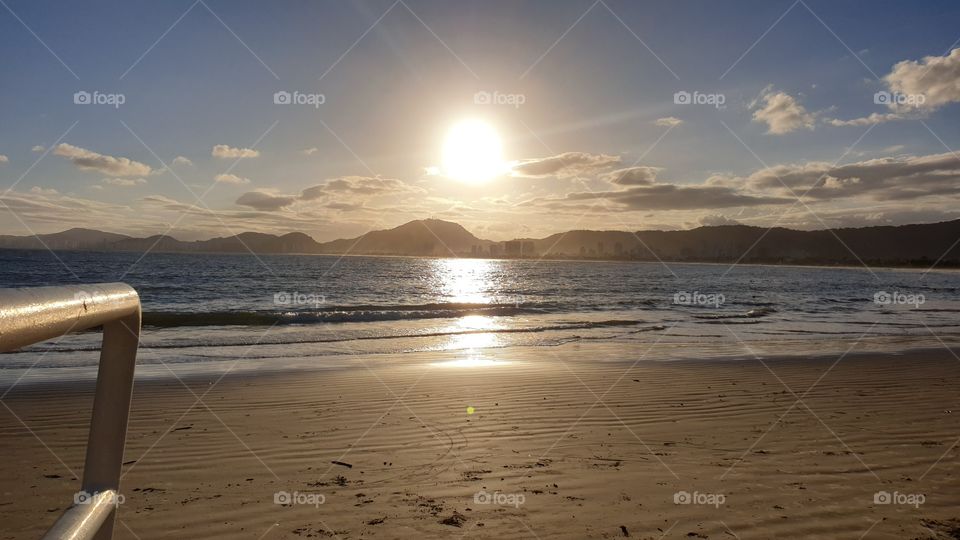 Enseada Beach in Brazil. Golden Sunset.