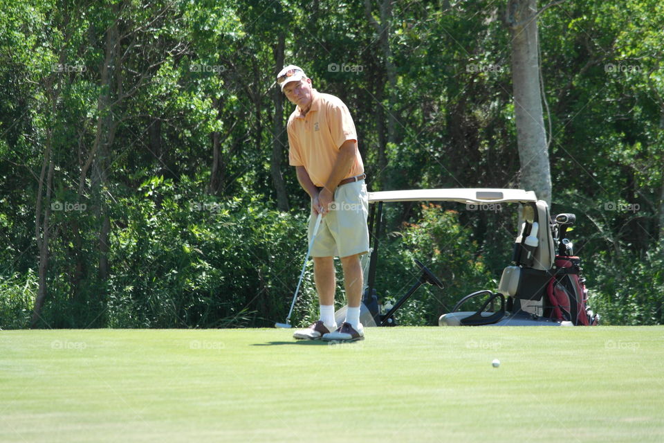 Man playing golf 