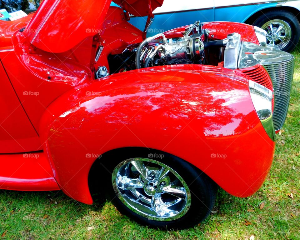 Color Red -   A Shiny red fender on an antique Ford Coupe. The primary purpose is to prevent sand, mud, rocks, liquids, and other road spray from being thrown into the air by the rotating tire.