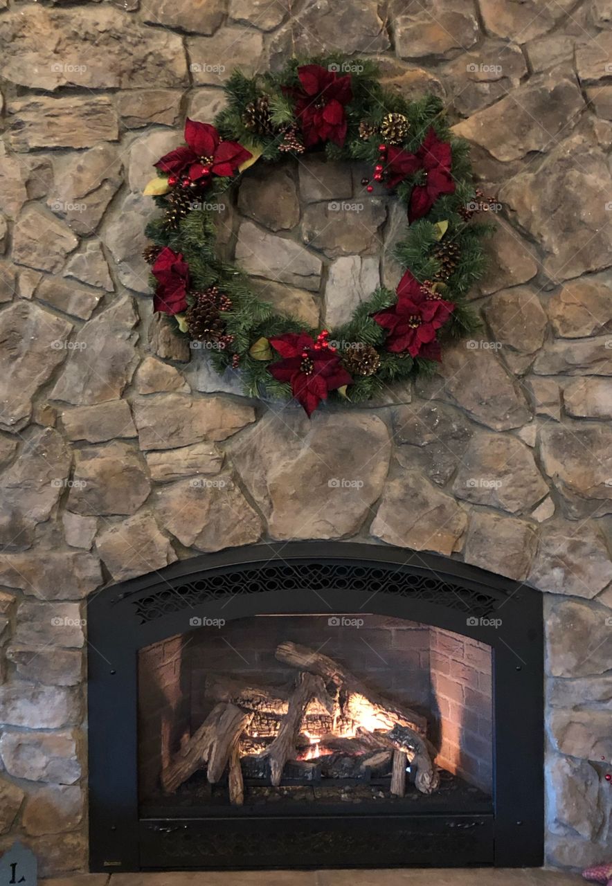 Simple and classic wreath over the fireplace for Christmas. Just Beautiful!  