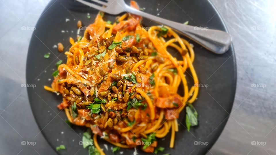 Spaghetti with Pancetta, Pepito seeds, fresh basil and grated parmigiano cheese