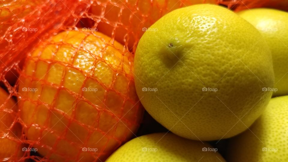 Lemons And Netted Oranges