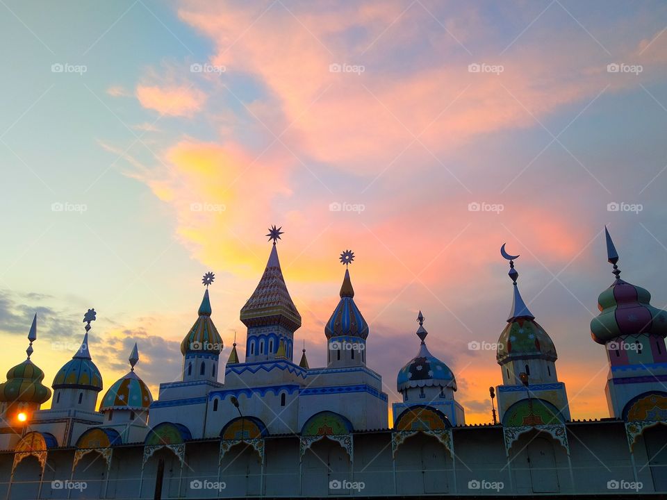 Domes of towers with different tips.  Sunset