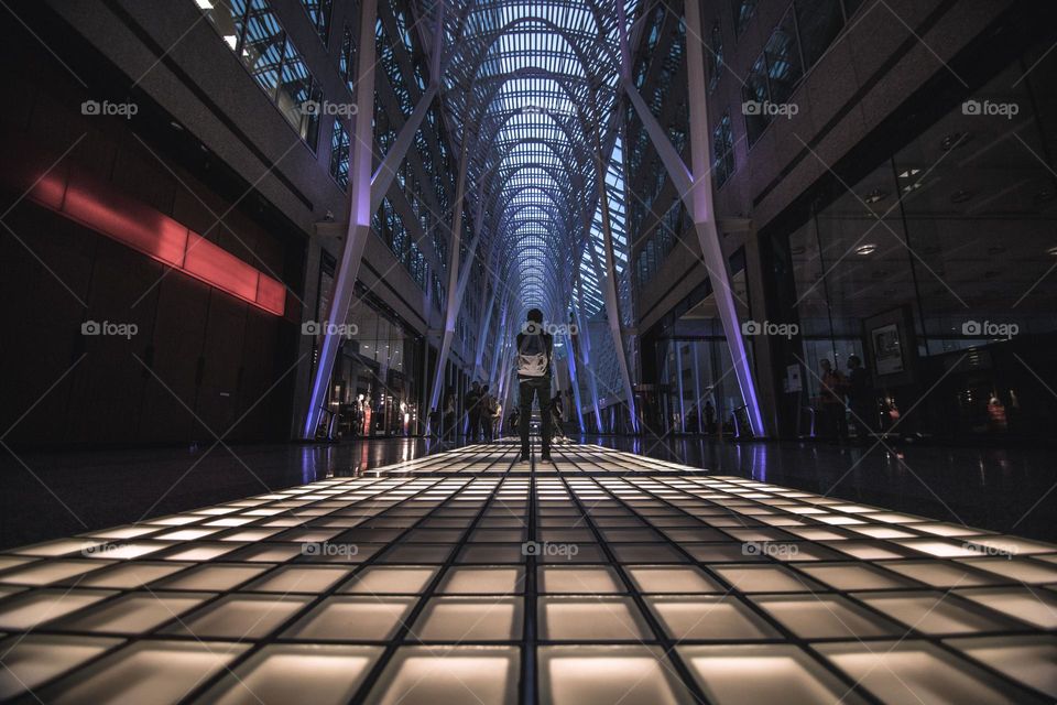 man stands on lit floor