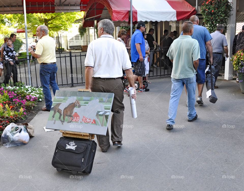 The Travers Dead Heat. Race fans leaving Saratoga at the end of the day. This painting in progress of the Travers stakes is being sketched. 