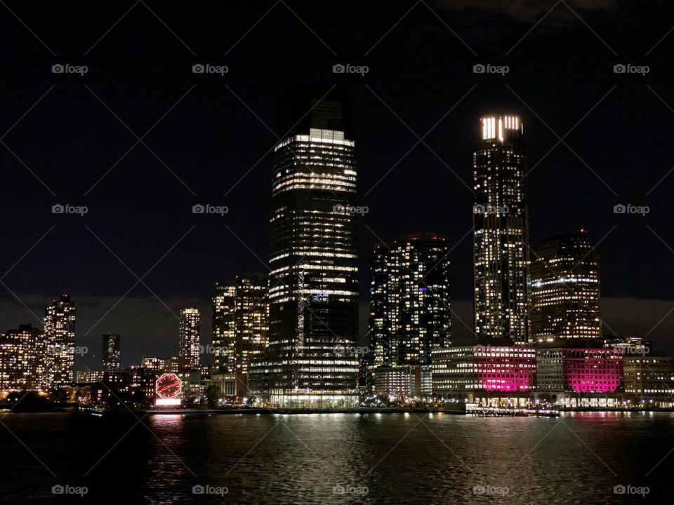 The New Jersey skyline at night viewed from the Hudson River