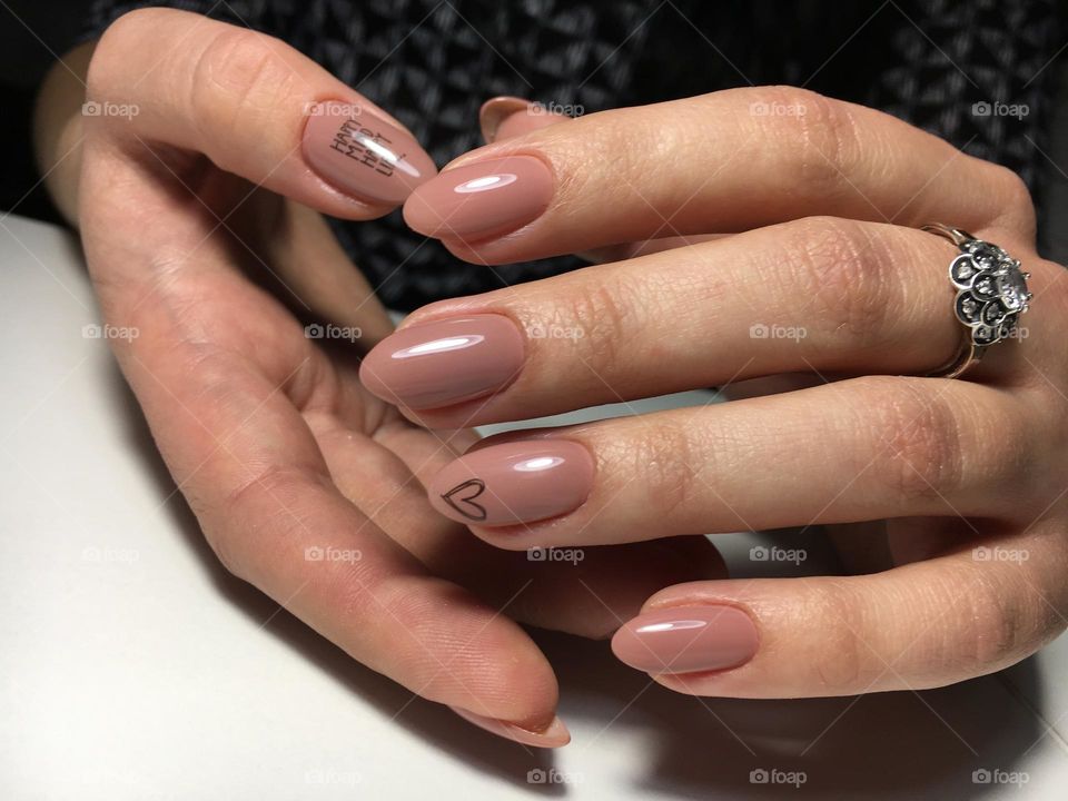 Painted nails, gel polish on nails, women's beautiful and neat manicure