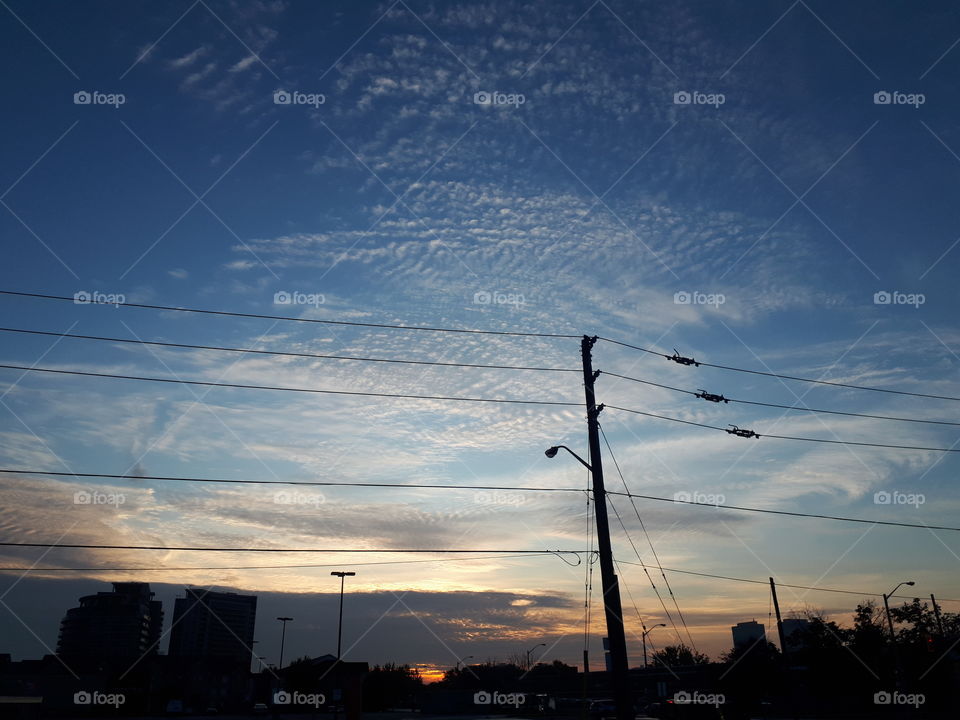 Odd clouds rolling into the sunrise.