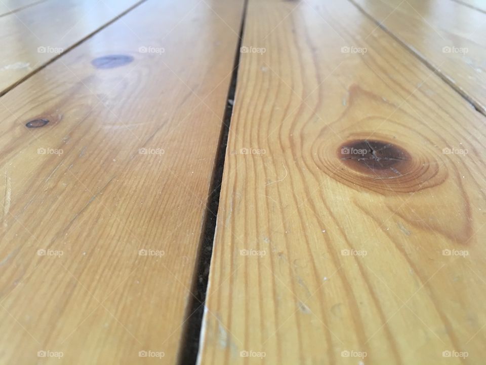 Wooden floor surface with a gap stock image 