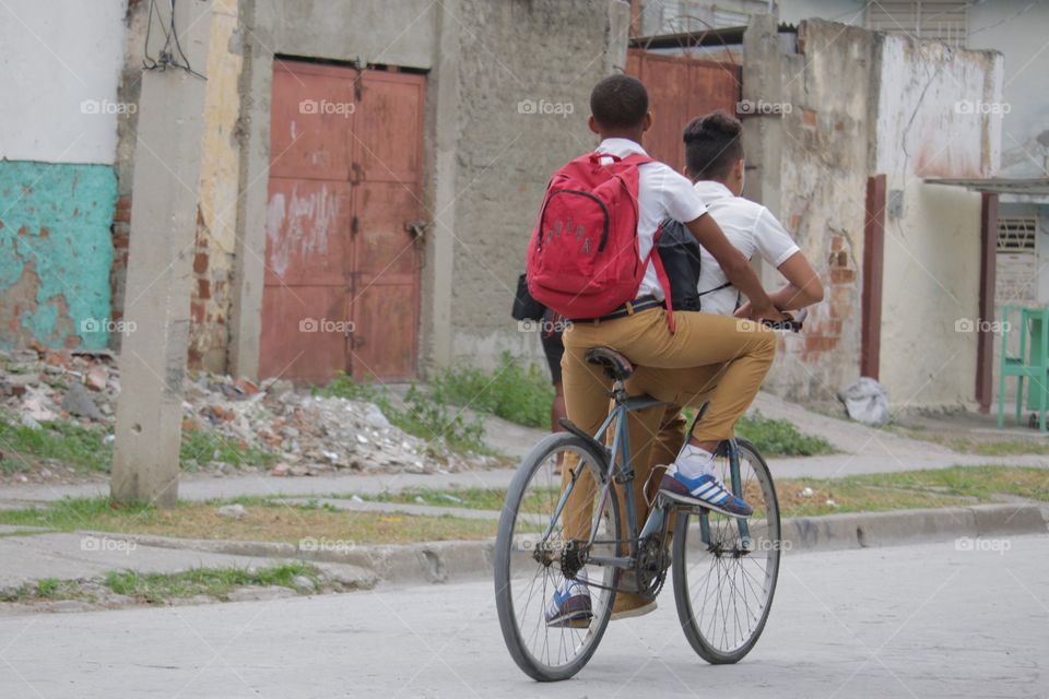 People In Cuba.School Boys On A Bike