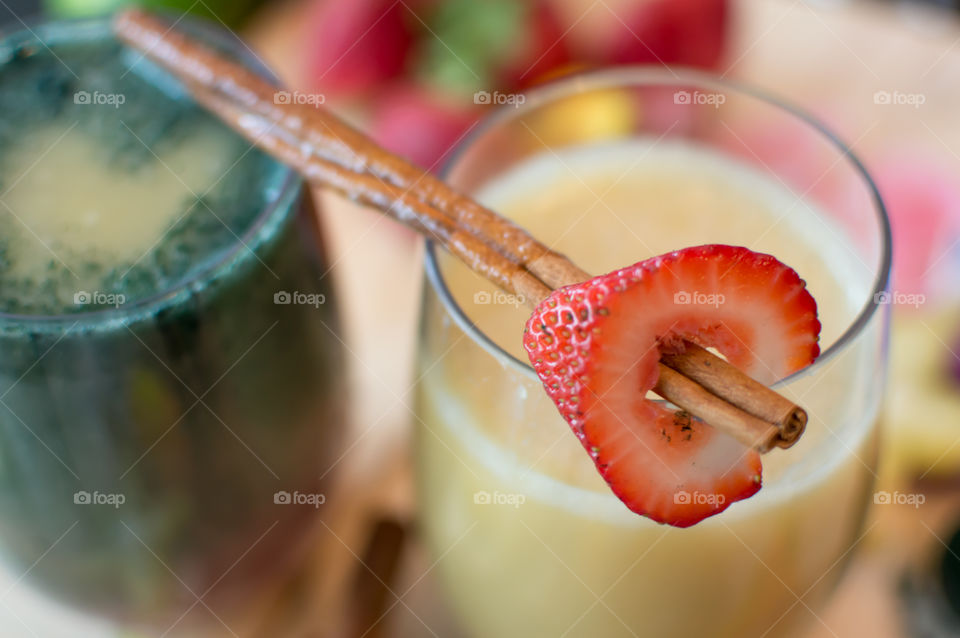 Fresh fruit smoothie love conceptual healthy lifestyle, heart healthy smoothie, protein rich shakes with hearts, strawberry and cinnamon stick 