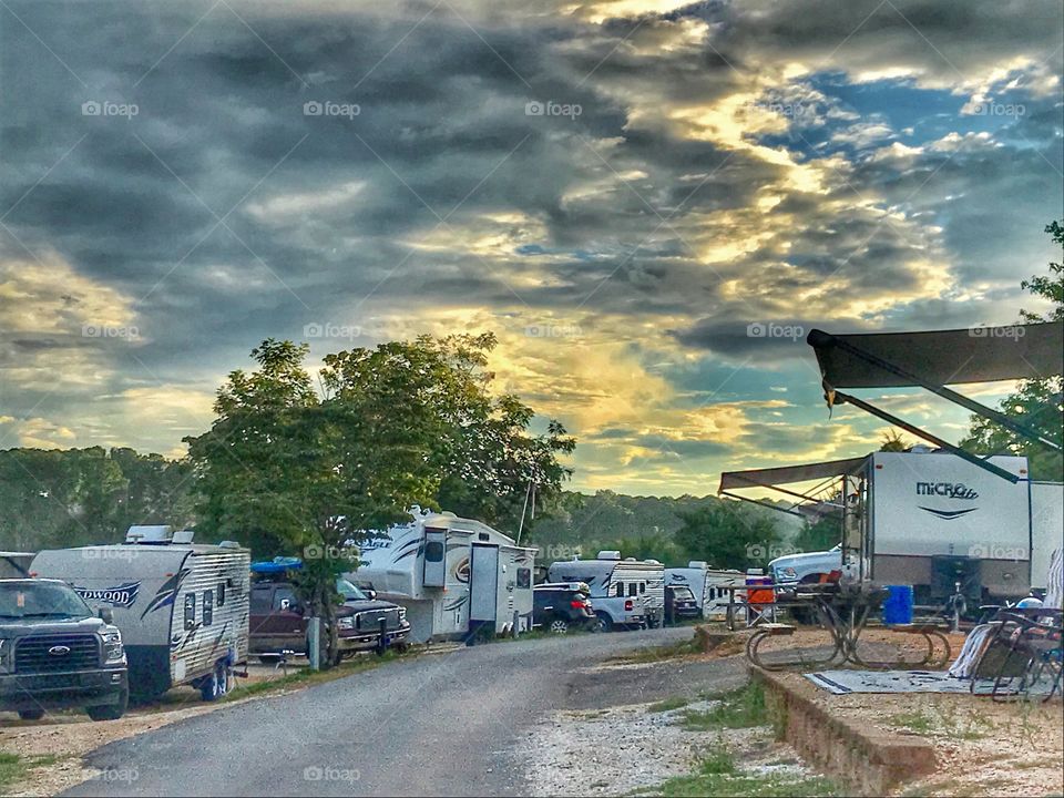 RV parallel parking in a campground by the lake