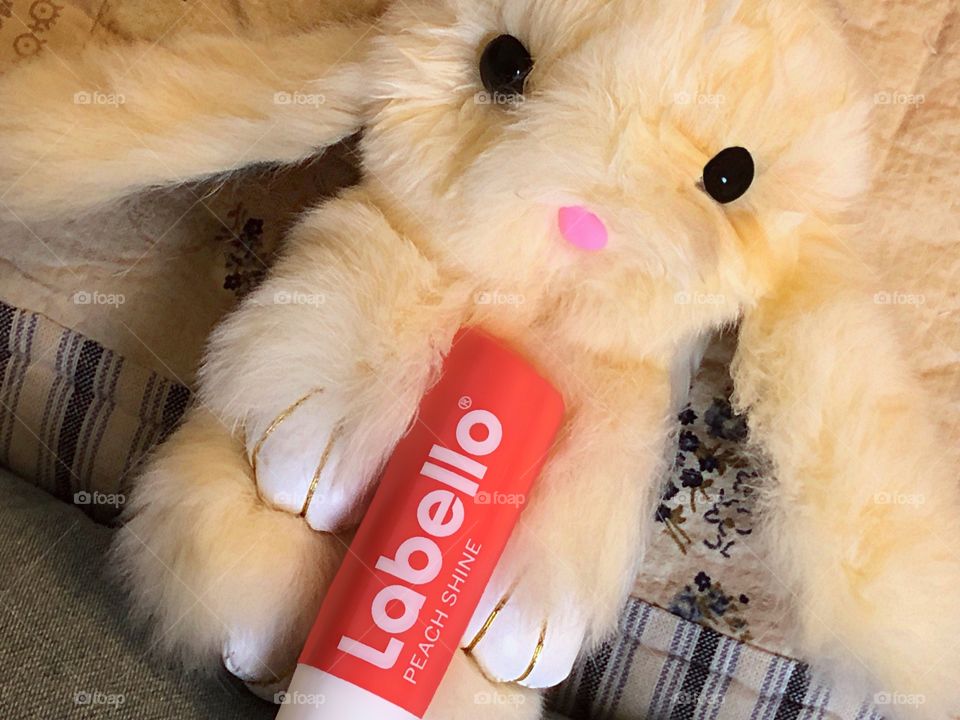 Labello lip balm cuddled by the soft fur of a bunny.  