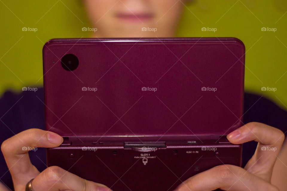 Playing videogames. Handheld console