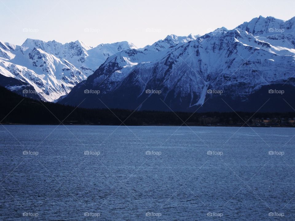 Snowy mountains and idyllic lake