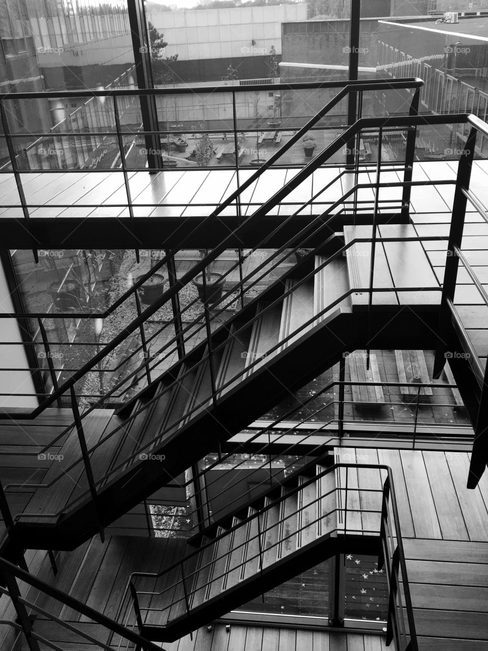 A view from a modern staircase - wood and steel; black and white 