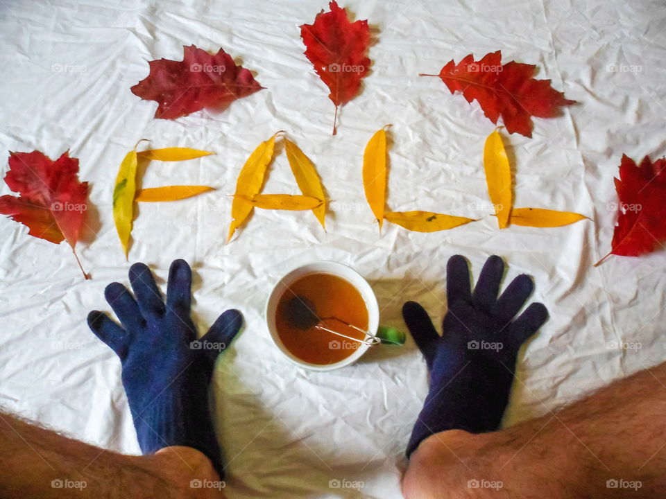 colorful autumn leaves and a cup of tea