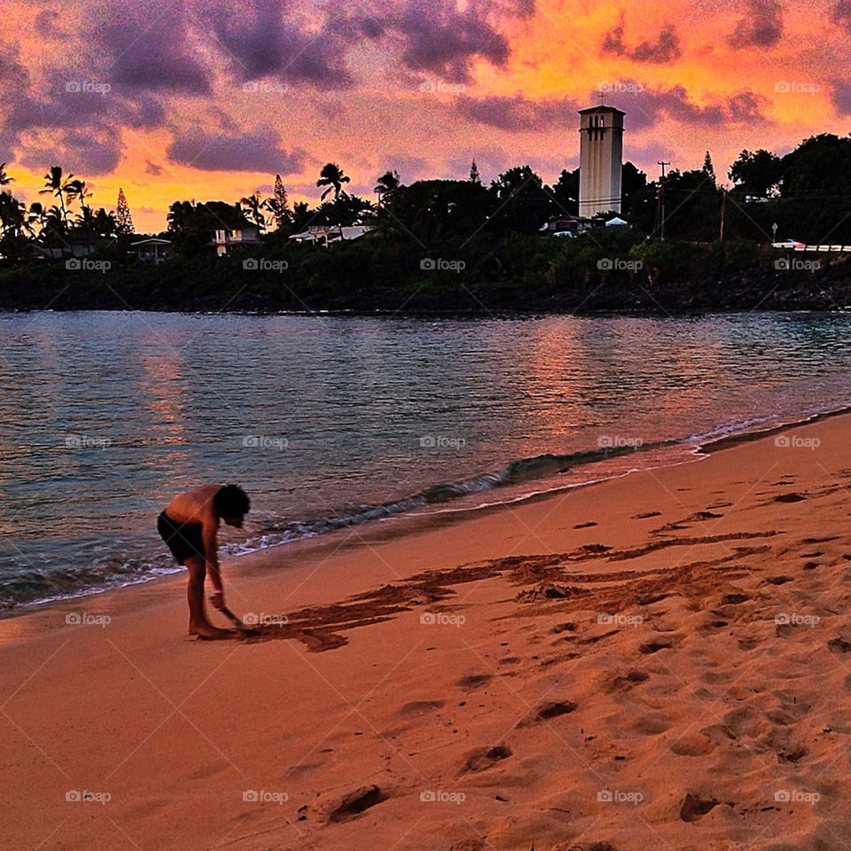 beach sunset man writing by susanmcintire