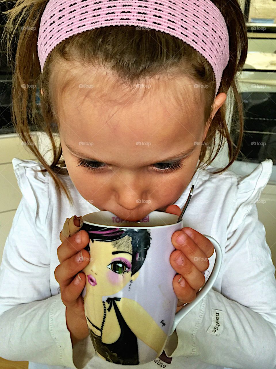 Extreme close-up of girl holding cup