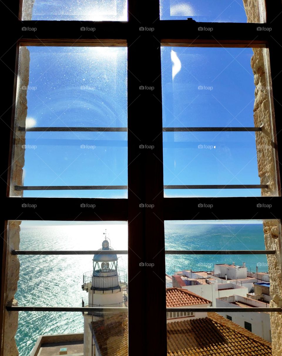 Looking at the lighthouse from the window