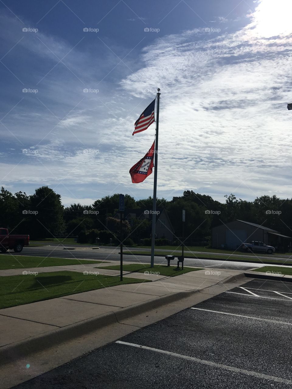 At the bank sitting waiting on hubby to take care of some business and watching the flags blow