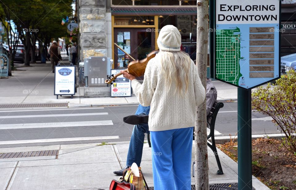 Elderly Violinist performing on street corner in Port Townsend, Washington