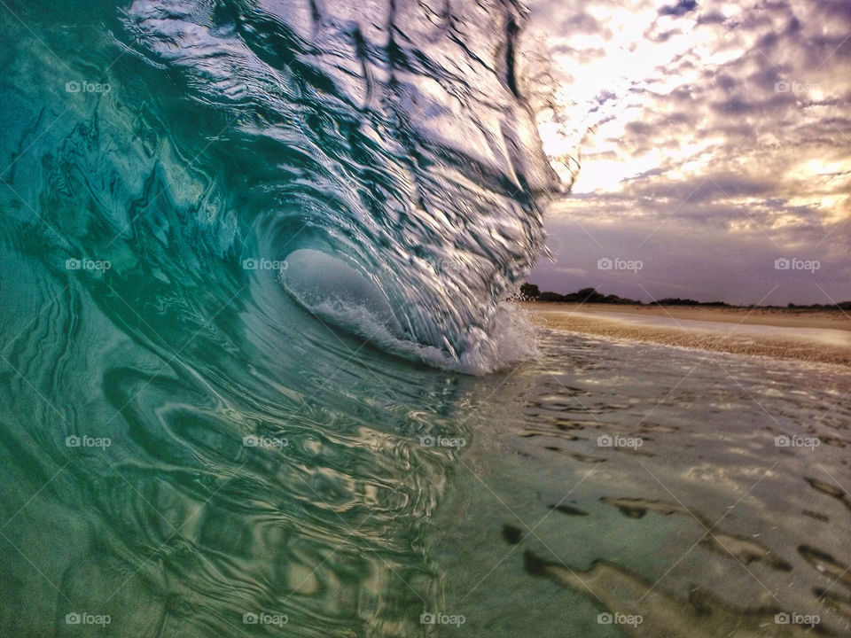 Morning light. Empty Hawaiian sunrise wave.