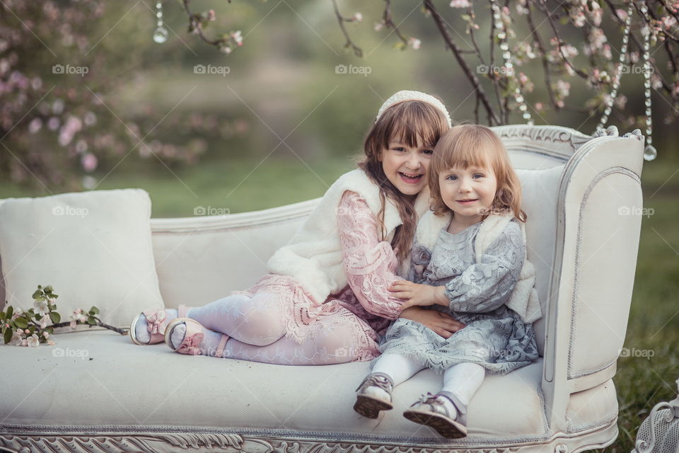 Little sisters in park