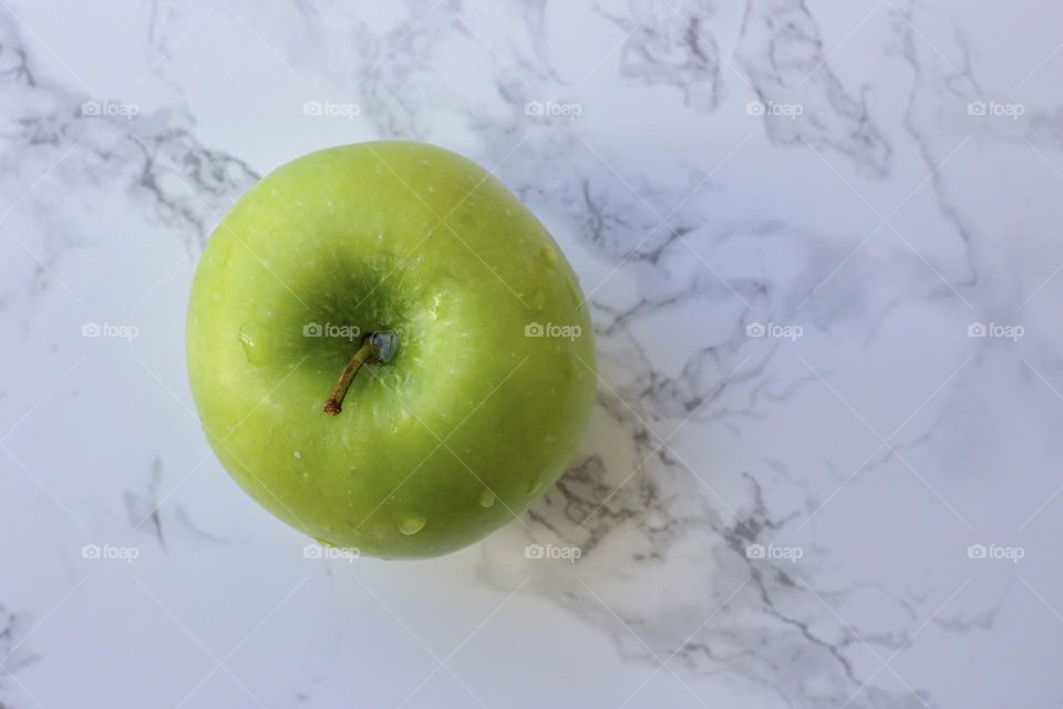 Green apple on the table 