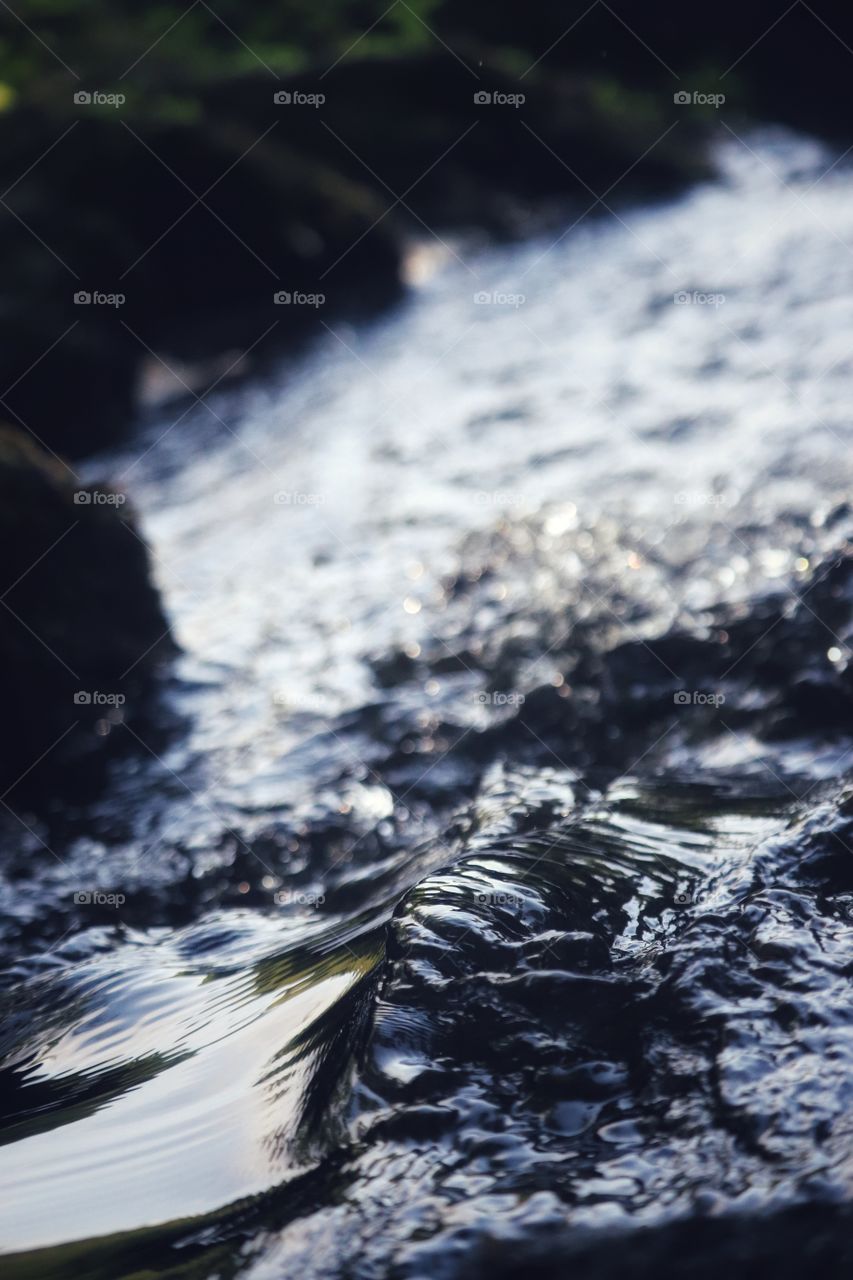 Water Cascading Through Rocks