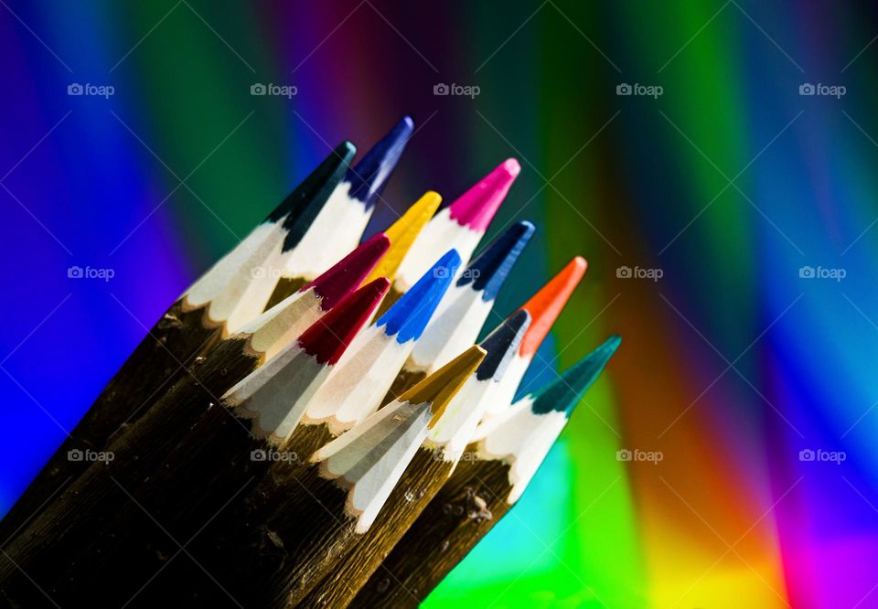 Colored pencils on a bright background.