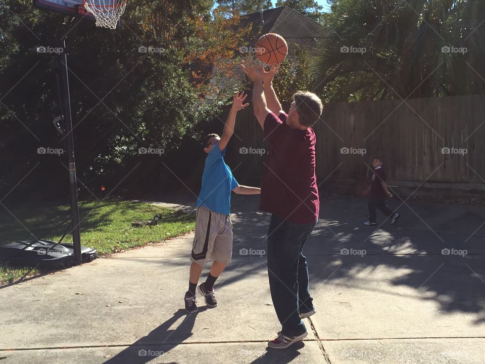 Dad and son basketball