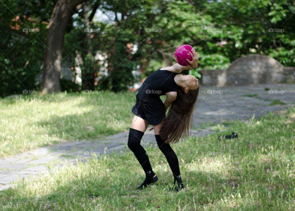 Beautiful Young Gimnast Dancing in Nature