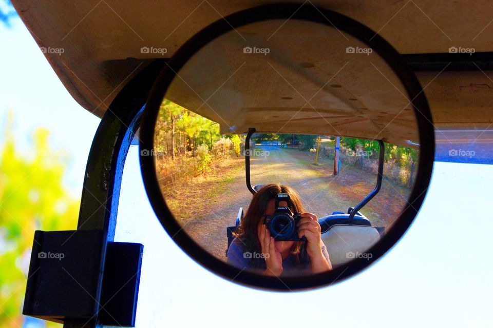 Taking pictures and riding in the golf cart