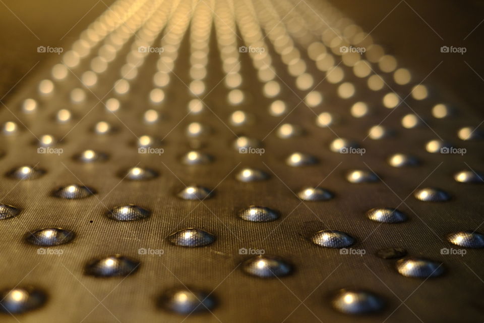 Close-up of metallic dots background