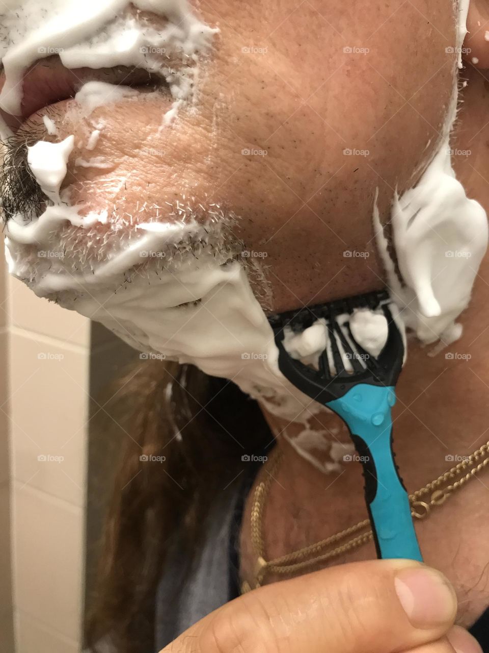 shaving with face foam close up