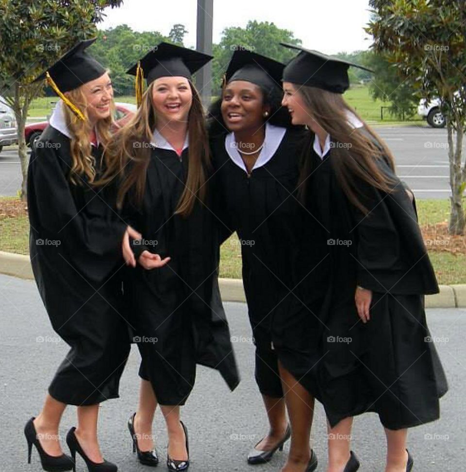 Group of happy female graduate students