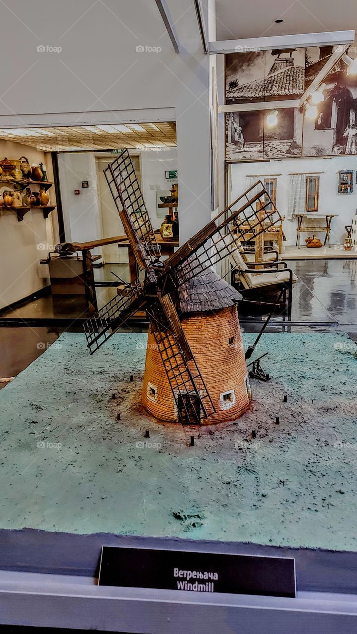 a model of a windmill in a museum