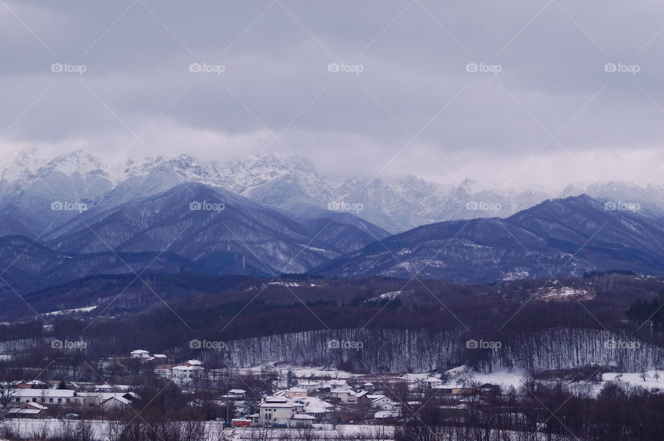 View of mountain range during winter