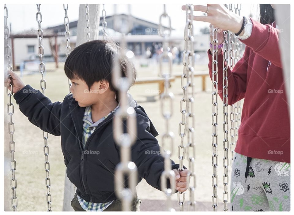 Japanese boy in winter camp playground