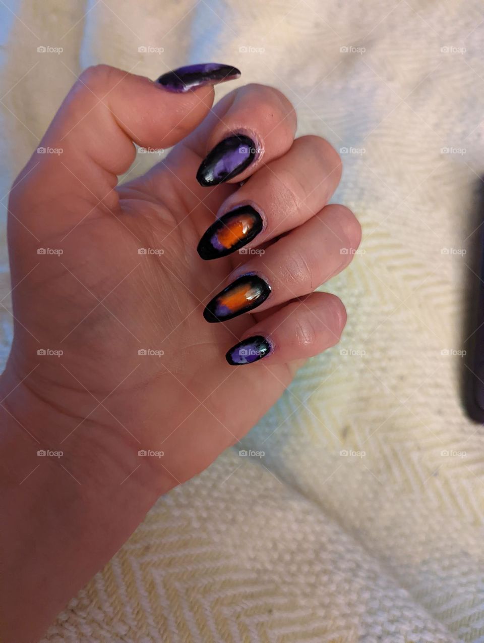 a failed attempt at ombre French tips covered up by blossoming gel and black gel polish