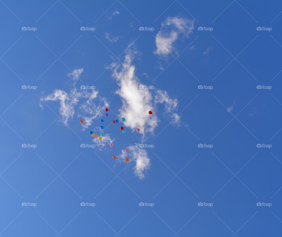 colour balloons in the blue sky clouds