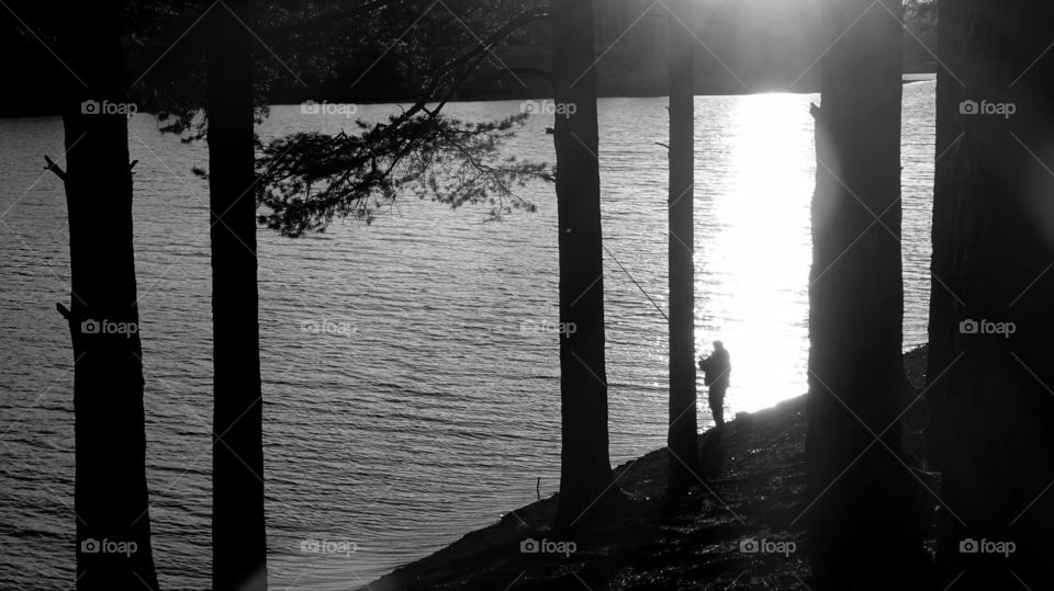 sunset on a reservoir and mountains in the Urals in Russia
