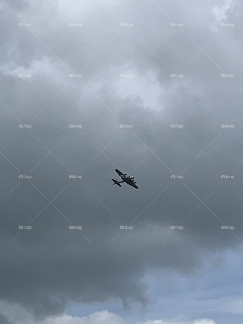 Airplane flying in a cloudy sky 