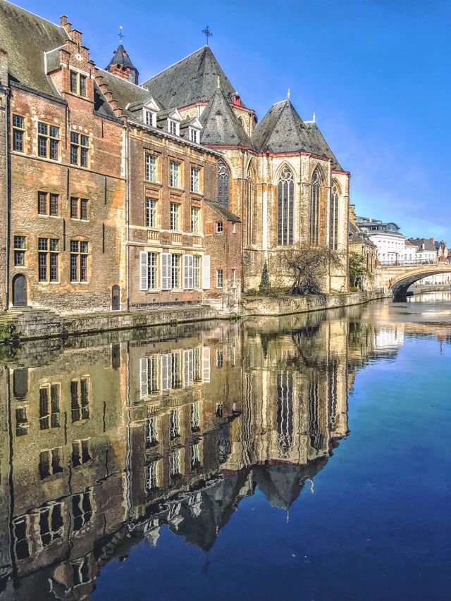 waterfront buildings, including Saint Michael’s Church in historic Ghent, Belgium