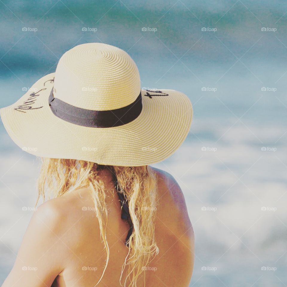 Woman enjoying beach vacation. 