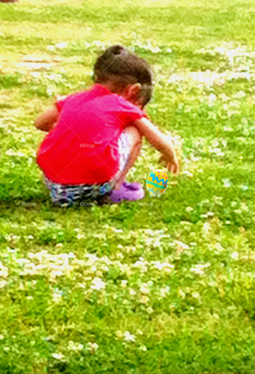 Child picking flowers. Little girl picking flowers