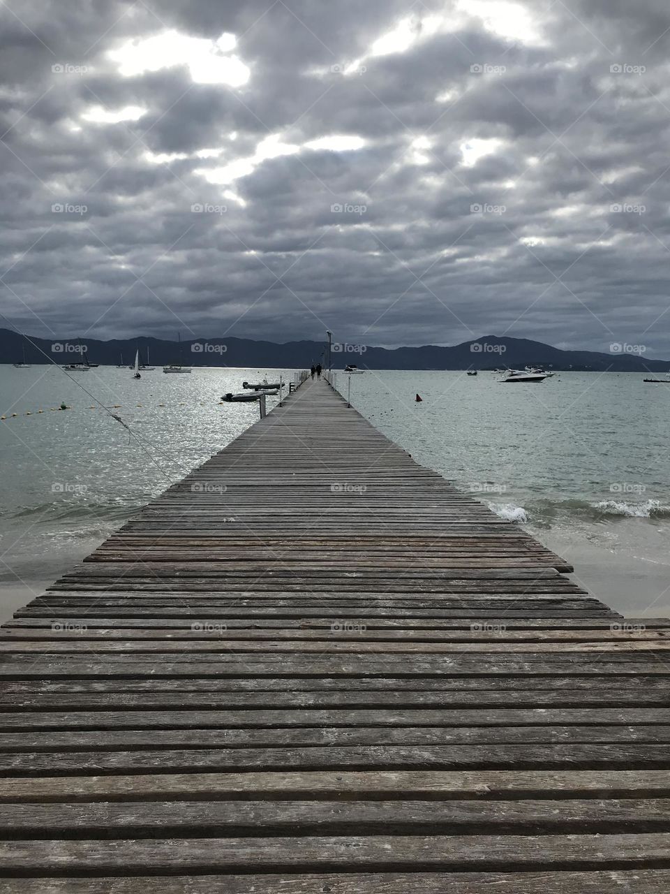 wooden pier at Jurere beach in Florianopolis, Brazil